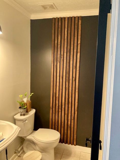 An easy project that can make a BIG impact! This slat accent wall is beginner friendly and can be completed in a day's time! Customize this slat wall to meet the look you are going for. BeforeThis is our half bathroom before I got the idea to add a little something. Was there anything wrong with this room? No. Could it use a little spunk to make it more interesting? Of course!I worked with the existing color scheme (in basically my whole house) of black, wood and green to create this… Simple Bathroom Accent Wall, Small Slat Wall, Wood Accent In Bathroom, Black And Wood Powder Room, Wood Slat Wall In Bathroom, Slat Accent Wall Bathroom, Slat Wall Powder Room, Slatwall Bathroom, Modern Accent Wall Bathroom