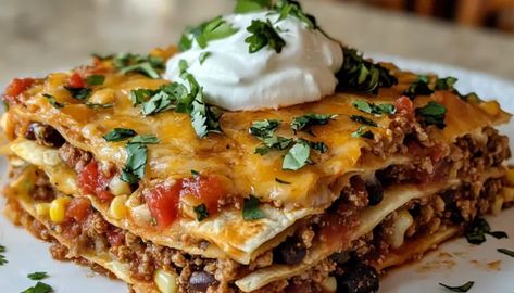 The Best Mexican Lasagna Recipe - getcakerecipes Mexican Style Lasagna, Mexican Lasagna Recipe With Tortillas, Mexican Chicken Lasagna, Mexican Lasagna With Tortillas, Mexican Lasagna Recipe, Taco Lasagna Recipe, Mexican Lasagna Recipes, Taco Lasagna, Best Lasagna