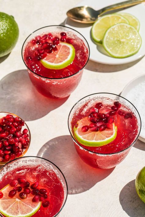 Next time you’re having people over, mix up a big batch of these Pomegranate Margaritas! Pomegranate juice gives this margarita a fruity twist without straying too far from the OG cocktail we all know and love. This recipe makes a serving big enough for a crowd, and you’ll all be going back for more! Pomegranate Margarita Mocktail, Cranberry Pomegranate Margarita, Big Batch Christmas Margaritas, Party Margarita Recipe, Pomegranate Margarita Pitcher, Batch Christmas Margaritas, Pomegranate Margarita Recipe Pitcher, Pomegranate Juice Cocktails, Fall Margarita Ideas