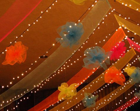 Party Ideas by Mardi Gras Outlet: Draped Deco Poly Mesh Ceiling Tutorial Draped Ceiling, Mesh Ceiling, Ceiling Draping, School Gym, Ceiling Hanging, Vintage Wedding Decorations, Mexican Party, Ceiling Decor, Deco Mesh