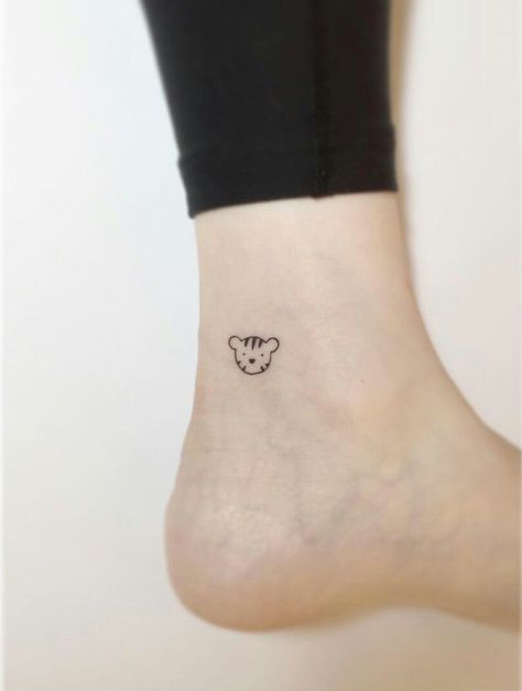 Tiny Tiger Tattoo Minimalist, Tiger Ankle Tattoo, Small Tiger Tattoo For Women Simple, Cute Cartoon Tattoos For Women, Cartoon Tiger Tattoo, Cartoon Lion Tattoo, Small Tiger Tattoo For Women, Minimal Tiger Tattoo, Tiny Tiger Tattoo