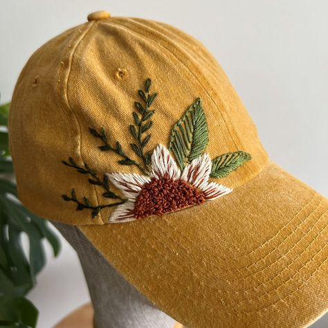 🌼🌼 All the flowers on the hat have been hand-embroidered, and each design is unique. These hats will shield you from the summer sun's heat and serve as the perfect complement to your outfits. ------------------------------------------------------------- Color: Yellow Design: hand embroidered with sunflowers Cap size (head circumference): 55 - 67 cm; Fabric: 100% cotton - Cotton threads This hat comes in a one-size-fits-all design with an adjustable back. You have the flexibility to customize t Hand Embroidered Baseball Hat, Hat Hand Embroidery, Hand Embroidered Hats, Embroidered Ball Cap, Embroidered Baseball Hat, Hat Embroidery Ideas, Embroidery On Hats, Embroidered Hats Ideas, Embroidered Sunflowers