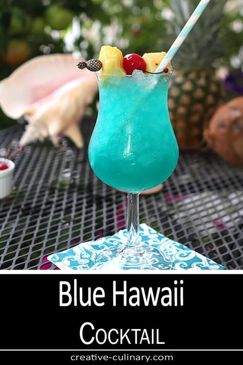 Need a vacation? Try one of these Blue Hawaii Cocktails and pretend you're laying on a beach somewhere! Blue Hawaii Drink, Hawaii Cocktails, Blue Hawaii Cocktail, Grenadine Syrup, Luau Food, Hawaiian Cocktails, Drinks Reception, Blueberry Mojito, Cocktail Umbrellas