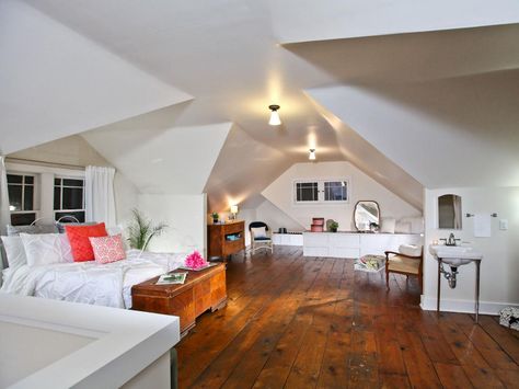 MASTER SUITE, AFTER: The walls were insulated with spray foam and covered with sheetrock to create an open-air master suite complete with a bed, bathroom and sitting area. Attic Master Suite, Rehab Addict, 1920s Bungalow, Attic Makeover, Nicole Curtis, Attic Renovation Ideas, Finished Attic, Bungalow Homes, Attic Design