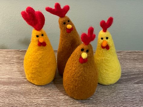 These colourful, cute and cartoony Easter chicken decorations are simple to make.
Made of carded wool and felted together using a felting needle. A great project for beginners. Chickens Cute, Easter Chickens, Felt Easter Crafts, Needle Felted Easter, Easter Magic, Needle Felted Ornaments, Easter Chicken, Chicken Crafts, Needle Felting Diy