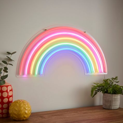 * Rainbow Design * Multicoloured LEDs * USB Operated - Multi-Room Use Add a burst of colour to your space with the Rainbow Neon Wall Light. The stunning, vibrant rainbow-coloured LED light instantly brightens your room. Stylish and USB operated for multi-room use, it can be easily fixed on the wall or leaned against it for a playful touch. Modern Rainbow Bedroom, Rainbow Theme Bedroom Kids Rooms, Senco Office, Toddler Rainbow Room, Colourful Girls Bedroom, Rainbow Playroom Ideas, Rainbow Room Kids Girl Bedrooms, Rainbow Theme Bedroom, Colourful Room Decor