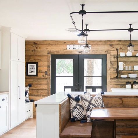 We love this kitchen from last week's reveal! The white cabinets, stained shiplap, black iron details, and built-in booth made this kitchen one of the most unique we’ve seen! Get ready for an all new Fixer Upper tonight at 9/8 CT on HGTV. #fixerupper Built In Booth, Stained Shiplap, Fixer Upper Kitchen, Shiplap Wall, Shiplap Accent Wall, Wood Walls, Ideas Vintage, Pantry Door, Wood Trim