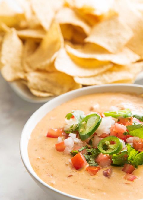 Queso Dip Recipe | SimplyRecipes.com Spicy Queso Dip, Queso Dip Recipe, Spicy Queso, Queso Dip Recipes, Diced Green Chilies, Queso Cheddar, Feta Dip, Queso Cheese, Queso Dip