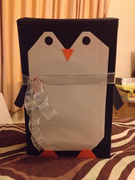 Christmas present wrapped like a penguin Penguin Christmas Wrapping Ideas, Penguin Gift Wrapping Ideas, Penguin Wrapping Ideas, Unique Gift Wrapping Christmas, Christmas Mailbox Decorations, Mailbox Decorations, Tissue Box Crafts, Christmas Present Wrap, Christmas Mailbox