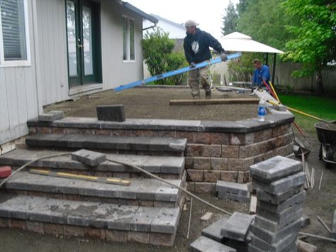 Raised Concrete Deck, Raised Concrete Patio Ideas, Raised Patio Ideas With Steps, Raised Stone Patio, Raised Concrete Patio, Deck To Patio Transition, Stone Paver Patio, Concrete Decks, Patio Plan