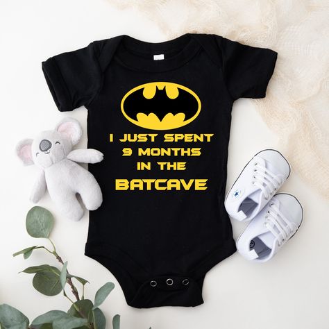 This adorable graphic Onesie® for the “Batman” enthusiast, this is a very popular item for babies. This is one of my "Best Sellers" and is a great baby shower or new baby gift. These can be customized in your choice of vinyl color as shown. Garments come only in Black, Gray & White. Onesies® come in a variety of sizes of your choice. We use high quality, soft flex vinyl which not only creates a sharp, vivid graphic but will never look "faded" or “washed out” like some inks commonly do. Processin Custom Onesies Boy, Baby Boy Batman, Batman Nails, Batman Baby, The Batcave, Superhero Baby Shower, Baby Batman, Graphic Onesies, Batman Inspired