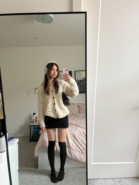 Sweaters And Mini Skirts Fall Outfits, Small Skirt Big Sweater, Skirt Big Sweater Outfit, Beige Mini Skirt Outfit Winter, Outfit With Beige Cardigan, Knee High Tights Outfit, Black Dress And Sweater Outfit, Mini Skirt Knee High Socks Outfit, Knee High Socks Outfit Fall