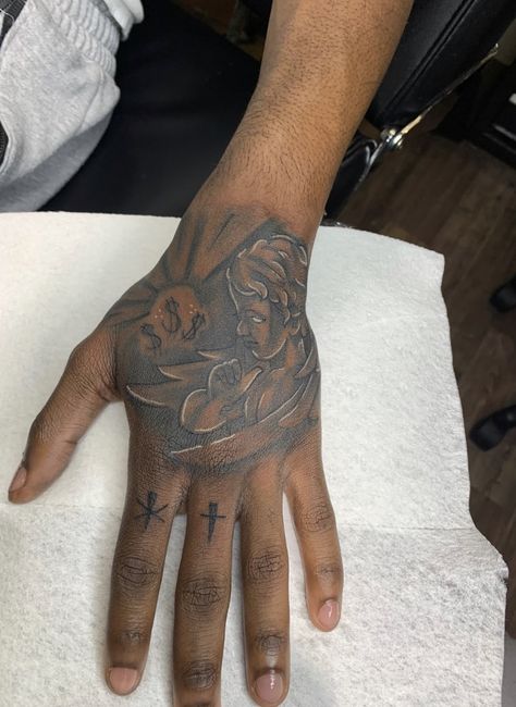 Hand Tattoo Spider Web, Tatoos Hand Man, Rare Hand Tattoos For Men, Small Baddie Tats Hand, Money Bag Hand Tattoo, Black Male Hand Tattoos, Fist Tattoo Ideas For Men, Hard Hand Tattoos Men, Tatoos Men Hand Ideas