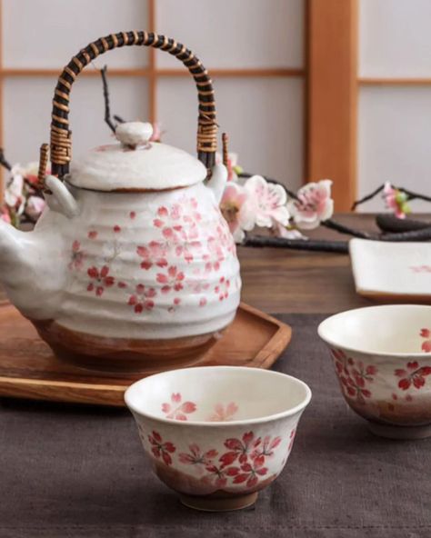 This handcrafted Japanese tea set brings the beauty of cherry blossoms into your home. With soft pink sakura petals delicately painted on rustic, earthy ceramics, it evokes the gentle flow of seasons and the warmth of tradition. The sturdy bamboo-wrapped handle adds a touch of craftsmanship, making each tea ritual feel special and authentic. Whether you're sharing tea with loved ones or enjoying a peaceful moment alone, this set offers a perfect blend of artistry and function. #mino__craft#m... Sakura Petals, Earthy Ceramics, Japan Gifts, Japanese Tea Set, Pink Sakura, Japanese Cherry Blossom, Ceramic Set, Japanese Ceramics, Tea Rituals