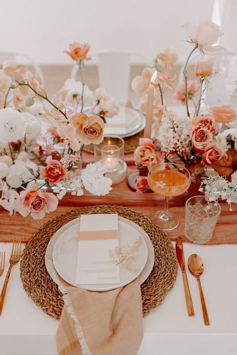 a sunset colored wedding table setting with blush, white and peachy blooms, a peachy table runner, a woven placemat and some candles Peach Wedding Decorations, Pnw Elopement, Bend Wedding, Pnw Wedding, Micro Weddings, Me Design, Byron Bay Australia, 22 December, 2024 Color