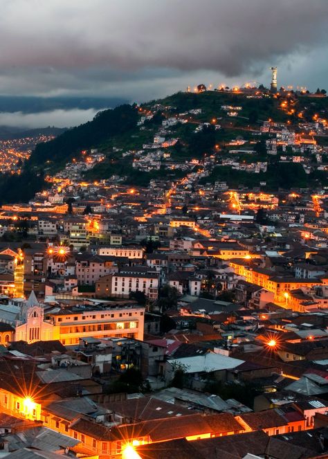 Jump on one of the city’s old trolleys and marvel at the attractions lit up at night. There are usually less people which makes it a lot more fun. To be on the safe side at night it’s best to travel with a group or your tour company.  The illuminated cathedrals are dazzling. One of the popular things to do in Quito is to stop and climb a hill with a view overlooking the city  12 Things to Do in Quito Ecuador: Culture, Food, Nature | Latin Roots Travel (Ecuador) Ecuador Culture, Ecuador Photography, Otavalo Market, Money Food, South America Travel Destinations, Ecuador Travel, Cloud Forest, Culture Food, Colorful Textiles