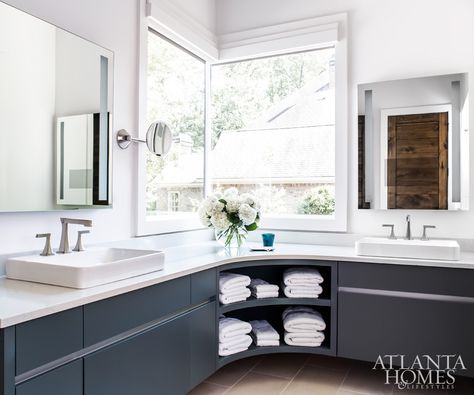 “With modern homes, you can get away with doing two corner windows like in the bathroom,” says Patrick of the unique window layout. The goal was to keep the room sophisticated but pared down, using simple can lighting, LED mirrors and hardware-free cabinets, which are painted a serene Down Pipe by Farrow Window Layout, Corner Windows, Can Lighting, Unique Window, Led Mirrors, Lighting Layout, Harrison Design, Fresh Farmhouse, Corner Window