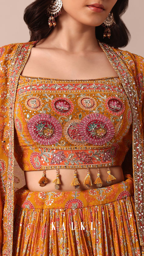 Illuminate the wedding festivities with our enchanting Mustard Yellow Printed Lehenga set. It features an intricately embroidered choli paired with a printed jacket and lehenga in georgette fabric. The ensemble is adorned with exquisite details such as cut dana, zari, sequins, mirror work, beads, metal coins, and tassels. The pack includes one embroidered choli, a lehenga, and a stylish jacket. Daman Design, Printed Lehenga, Chinese Fashion Street, Wedding Festivities, Chinese Fashion, Saree Designs Party Wear, Printed Jacket, Kurti Design, Designer Dresses Casual