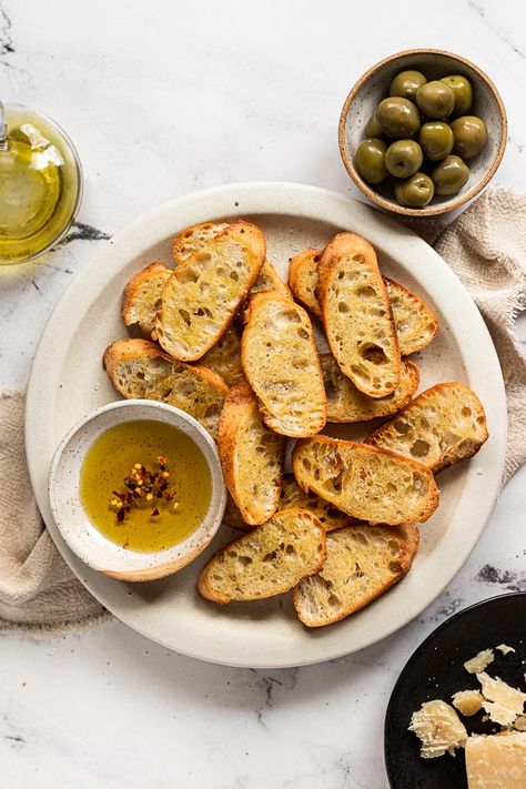 Slices of baguette turn into golden, crispy crostini and are the perfect base for easy, hand-held appetizers. Top crostini with your favorite cheese and flavor combinations, or serve them alongside a dip. There's no wrong way to enjoy these little toasts! Crispy Baguette Slices, Crispy Crostini, Easy Crostini, How To Make Crostini, Crostini Toppings, Crostini Recipe, Crostini Appetizers, Crostini Recipes, Toast In The Oven