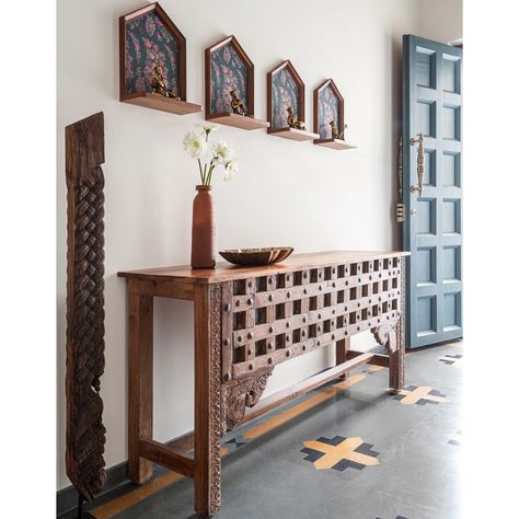 This home - Prangan, has a lot of vintage, repurposed furniture that we have used.  To keep it authentic to the style, we travelled to Kochi to source these pieces and they literally are conversation starters in this home.  This gorgeous teak console has the most detailed carvings and probably repurposed from a door and the corbels add to its vintage charm.  Above the console are shelves that were made on site and they house these antique brass sculptures depicting musicians of the bygone era (again from Kochi) ❤️  . #studioipsa #foyer #foyerdecor #foyerdesign #foyerconsole #entryway #entrywaydecor #entrywaydesign #interiordesign #interiorstyling #homedecor #interiordesigninspiration #interiordesigninspo #interiordesignideas #homeinspiration #homeinteriors #interiorinspiration Vestibule Ideas Entryway, House Roof Design, Living Room Partition, Living Room Partition Design, Foyer Decor, Art Decor Diy, Room Partition Designs, Foyer Design, Entry Way Design