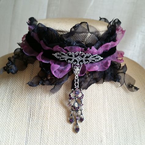 "THIS CHOKER SOLD ON ANOTHER SALES PLATFORM Beautiful & elegant hand sewn Gothic, Renaissance, Steampunk inspired black velvet/purple/black organza choker w attached sewn in pewter colored filigree & purple/pink gemstone pendant. The choker section is 13\" & 3\" wide. Pendant hangs 4 1/2\". fiber stands/tie back at 35\" Wear it tied back, or pull the beautiful fiber strands to the front for a fuller effect - see all photos.  A lot of effort went into designing and making this choker & it will be Steampunk Choker, Gothic Choker Necklace, Purple Choker, Purple Goth, Goth Outfit Ideas, Purple Gothic, Velvet Purple, Gothic Choker, Goth Accessories