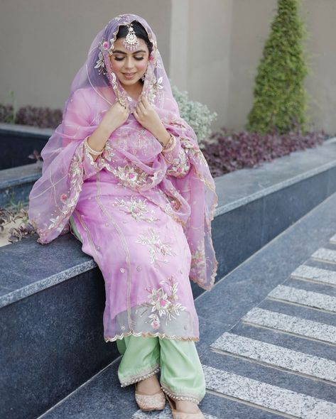 ਫਰਾਹ | Farah Discover bespoke elegance with our Lavender Pink organza suit, beautifully complemented by a Spring Green silk bottom. Each piece is meticulously handcrafted with zardosi, mukash, resham, shippi, tilla, and aari embroidery, offering you a personalized touch in color, design, and budget. Outfit:- @elaahi_by_roop_mann Makeup:- @blushstories_by_manpreetkaur Photography:- @thegagansukhphotography Made to order | Shipping Wordwide To reach out, kindly DM or whatsapp (+91 9915407... Lavender Suit Design, Pink Suit Combination, Pink Organza Suit, Pink Punjabi Suit, Lavender Suit, Designer Suits For Wedding, Organza Suit, Punjabi Dresses, Denim Style Casual