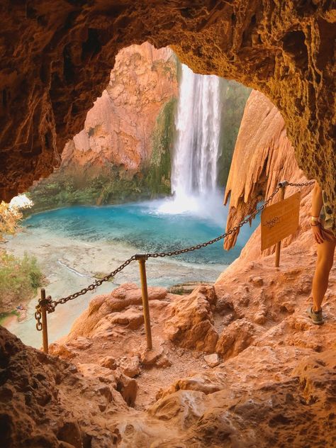 The hike to Mooney Falls in Havasupai, Arizona is stunning because you have a view of the falls all the way to the bottom. Near the top, there are two short caves to crawl through. After the first cave, you get this incredible view. Don't linger too long though because people are coming up and going down the same spots. Read this post for more information on hiking to Havasupai and down to Mooney Falls. Havasupai Arizona, Arizona Waterfalls, Arizona Aesthetic, Havasupai Falls, Adventurous Travel, Arizona Vacation, Havasu Falls, Visit Arizona, Board Aesthetic