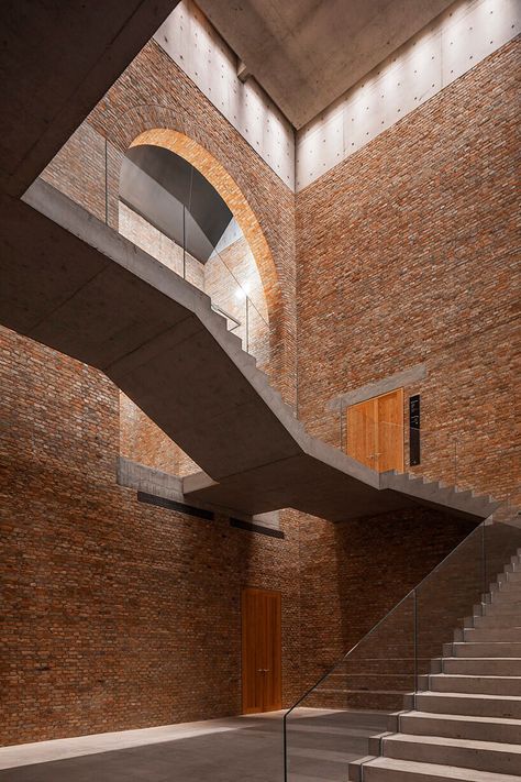 798CUBE art museum renovated using modern concrete forms Art Museum Architecture, Black Brick Wall, Museum Interior, Renovation Architecture, Masonry Work, Alpine Design, Stairs Architecture, Brick Texture, Concrete Forms