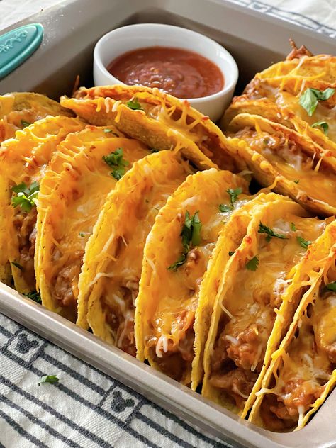 These easy oven-baked tacos are a game-changer for taco night! With seasoned ground beef, refried beans, salsa, and melted cheese, all baked together in crunchy taco shells, this recipe makes a delicious, mess-free meal everyone will love. Perfect for family dinners, game days, or casual gatherings—just add your favorite toppings and dig in! Baked Beef Tacos Oven, Rotel Tacos Ground Beef, Oven Baked Tacos Ground Beef, Baked Tacos Beef, Hamburger Tacos, Rotel Tacos, Crunchy Tacos, Oven Baked Tacos, Crunchy Taco Shells