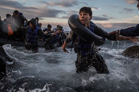 Oct. 1, 2015. After battling rough seas & high winds from Turkey, migrants arrive by rubber raft on a jagged shoreline of the Greek island of Lesbos. | Credit: Tyler Hicks / The New York Times || The New York Times & Thomson Reuters shared the 2016 Pulitzer Prize for breaking news photography for coverage of Europe’s refugee crisis.|| more photos: https://www.facebook.com/nytimes/posts/10150793251599999 Moving Photos, Cannes Lions, Photo Awards, Ansel Adams, Greek Island, Libya, Documentary Photography, Tv Commercials, Alberta Canada