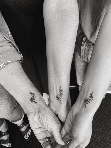 3 generations matching tattoo : daughter, mom, and grandmother Matching Tattoos Mother Daughter Grandma, Matching Tattoos For Mom Daughter And Grandma, Grandma Mother Daughter Tattoos, Grandma Mom And Daughter Tattoo, Generational Tattoos, Matching Grandma Granddaughter Tattoos, Generations Tattoo, Grandma And Grandpa Tattoos, 3 Generation Tattoo Ideas