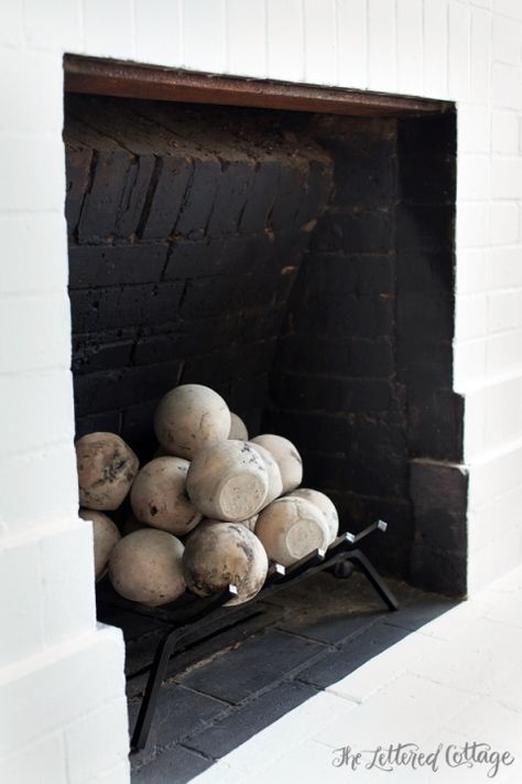 Fireplace | Cannon Balls | Burning | Old House | Living Room Old House Living Room, Cheap Basement Remodel, Small Basement Remodeling, The Lettered Cottage, Lettered Cottage, Southern Style House, Southern Interior, Basement Fireplace, French Country Living Room