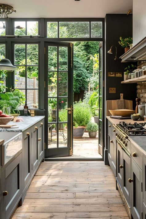 Greenhouse Inspired Kitchen, Glass Enclosed Kitchen, Atrium Kitchen Extension, Kitchen With Doors To Outside, Atrium Addition, Inside Outside Kitchen, Conservatory Kitchen Extension, Greenhouse Dining Room, Orangery Extension Kitchen