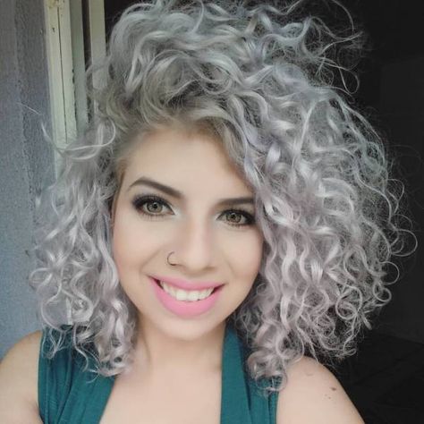 ash blonde hair color/Voluminous Platinum and Purple Curls Almost violet, this curly hair in platinum blonde is adorable! Springs dance freely, as the natural curls are defined but incredibly soft and touchable. This can be paired with any look to instantly dress you up, and watch as others are amazed by your locks! Curly Color, Ash Blonde Hair Colour, Grey Curly Hair, Platinum Blonde Hair Color, Blonde Curly Hair, Blonde Curls, Colored Curly Hair, Ash Blonde Hair, Platinum Hair