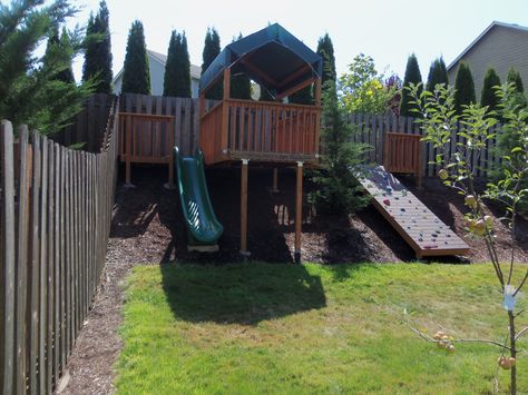 Backyard hillside rock wall, slide and play area, sloped yard Playground Landscaping, Sloped Backyard Landscaping, Play Area Backyard, Sloped Yard, Play Garden, Kids Backyard, Sloped Backyard, Landscaping Retaining Walls, Hillside Landscaping