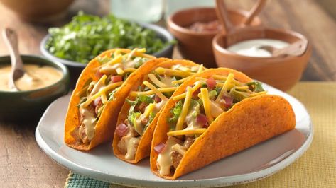 These tacos are sure to be a hit with your family with a cheesy nacho shell and topped with two additional cheeses. Even better, they come together in only 10 minutes! Del Taco, Easy Taco, Cheesy Chicken, Taco Recipes, Taco Bell, Mexican Dishes, Mexican Recipes, Copycat Recipes, I Love Food