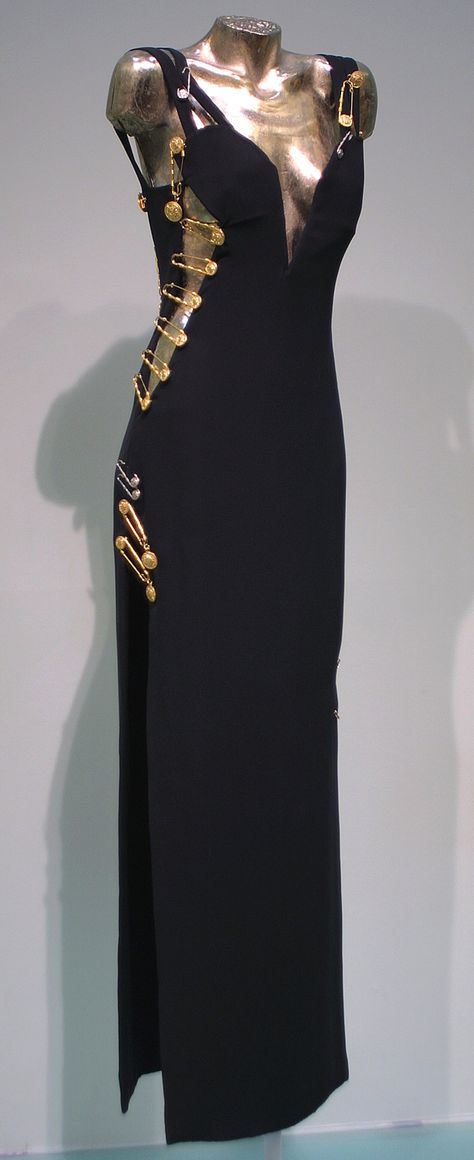 Evening gown worn by Elizabeth Hurley, Spring-Summer 1994, Versace, black viscose and acetate with kilt pin embellishments Versace Black Dress, Vintage Versace Dress, Black Versace Dress, Versace Aesthetic, Safety Pin Dress, Versace Safety Pin, Pin Dress, Versace 90s, Versace Vintage