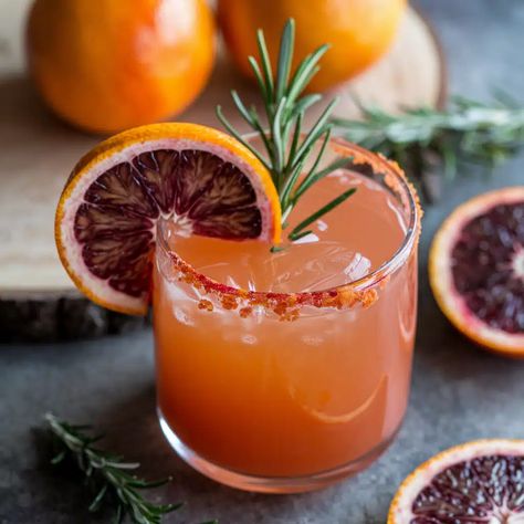 Blood Orange Mocktail Citrus Mocktail, Thanksgiving Mocktails, Blood Orange Mocktail, Orange Mocktail Recipes, Orange Mocktail, Winter Mocktails, Cranberry Fizz, Christmas Mocktails, Blood Orange Margarita