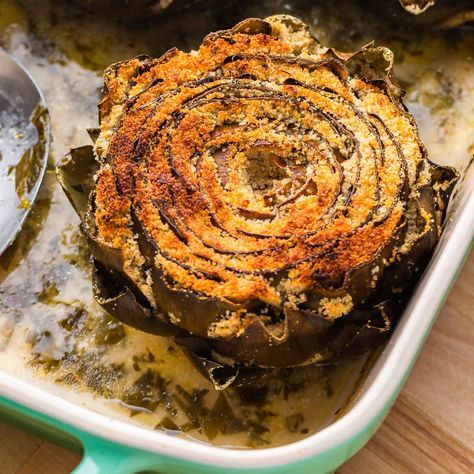 Artichokes are cleaned and stuffed with garlicky breadcrumbs and baked in a buttery lemon and white wine sauce until tender. Italian Stuffed Artichokes, Lemon White Wine Sauce, Sip And Feast, Stuffed Artichokes, Baked Artichoke, Artichoke Recipes, Italian Appetizers, Wine Sauce, Anchovies