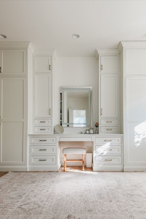 Primary bedroom closet with built in vanity details featuring creamy whites, natural wood tones, and gold detail. Loving this vintage inspired Becki Owens rug to warm up the space Home organization, spring refresh, home finds, primary bedroom closet, vanity stool, designer closet, gold detail, creamy whites, warm woods, vintage inspired rug, Becki Owens, vanity mirror, Amazon Prime, found it on Amazon, Target, light and bright, aesthetic closet, organized home Vanity Ideas Bedroom Built In, Built In Vanity Bedroom, Clothes Closet In Bathroom, Built In Vanity In Bedroom Master Suite, Built In Closet With Vanity, Closet Designs With Vanity, Primary Bedroom Built Ins, Built In Wardrobe With Vanity, Vanity Ideas Closet