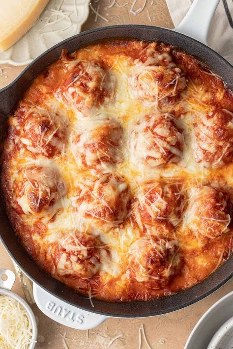 Enjoy a twist on classic chicken parm with this Baked Chicken Parmesan Meatballs recipe! Perfect over a bed of spaghetti or as an appetizer on game day. Chicken Parm Meatballs, Greek Turkey Meatballs, Chicken Marinara, Greek Turkey, Chicken Parmesan Meatballs, Homemade Tzatziki Sauce, Parmesan Meatballs, Chicken Meatball Recipes, Tasty Meatballs