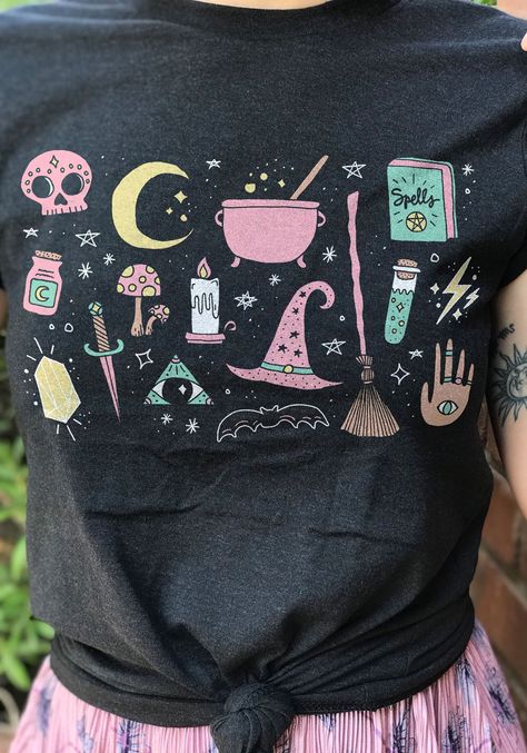 Even witches like to doodle sometimes. Let the cauldron bubble while you grab this magical tee in Black Heather. 90% combed and ring-spun cotton, 10% polyester. Model wears size Small. Slim-fit unisex style. Check the size chart for your perfect fit! Bruja Shirts, Mystical Doodles, Celestial Doodles, Witch Clothing, Hippie Posters, Womens Graphic Tees, Witch Outfit, Heart Tee, Velvet Hair