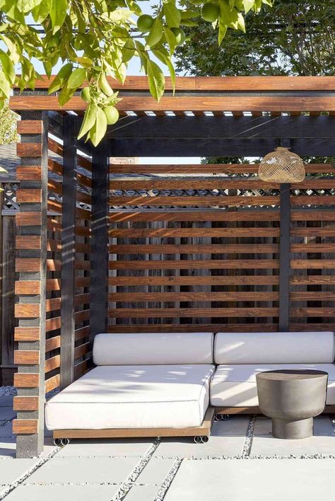 Pool cabanas are a welcome addition to any backyard, offering a shaded lounge space tailored to your lifestyle. Here are some cool and stylish pool cabana ideas. #outdoordecor #poolcabanas #patiodecor #shadebackyard #apartmentliving #smallspacedecorating #thespruce Outdoor Cabana Lounge, Patio Cabana Ideas, Backyard Daybed Ideas, Tropical Cabana Ideas Backyard, Pool Outhouse Ideas, Pool Side Pergola Ideas, Poolside Shade Ideas, Backyard Sunbathing Area, Small Cabana Ideas Backyard