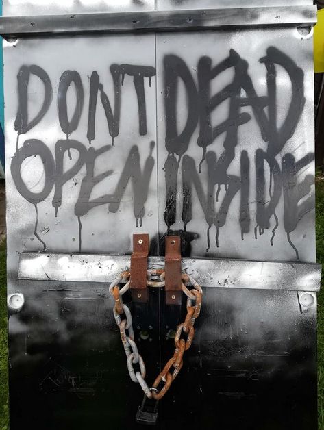 Zombie Front Yard, Zombie Apocalypse Haunted House, Zombie Apocalypse Decor, Zombie Door Decorations, Zombie Apocalypse School, Texas Tech Wallpaper, Diy Zombie Decorations, Zombie Photoshoot, Door Decorations For School