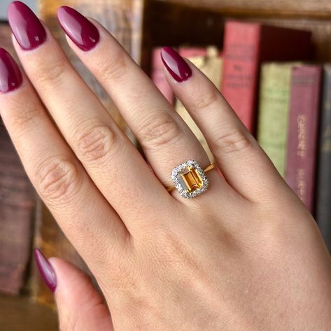 New in! A striking vintage topaz diamond cluster ring made in London in 1963. The radiant emerald-cut yellow topaz weighs approx. 1.85ct and displays a golden honey-coloured hue that’s complemented by a frame of twinkling diamonds around the border. The stones are set in a platinum gallery with 18ct gold back and band complete with hallmarks. It would make a gorgeous engagement ring, exhibiting a warm, golden gem at its heart. Get 15% off when you sign up for our newsletter! Interest-fre... Topaz Engagement Ring Yellow, Yellow Topaz Ring, Edwardian Engagement Ring, Golden Honey, Colored Engagement Rings, Topaz Engagement Ring, Gorgeous Engagement Ring, Dream Engagement, Dream Engagement Rings