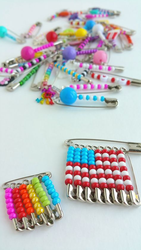 she even made some friendship pin earrings! so fun ♥ Friendship Pins How To Make, Safety Pin Friendship Pins, Friendship Pins 80's, Diy Safety Pin Jewelry, Friendship Pins, 80s Crafts, 90s Crafts, Safety Pin Jewelry Patterns, Safety Pin Art