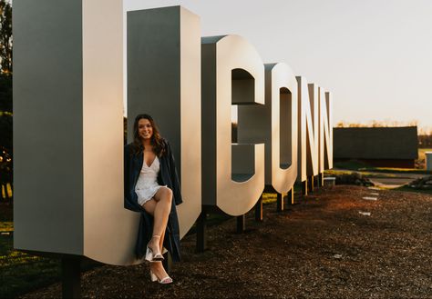 Uconn Graduation Cap, Golden Hour Graduation Pictures, Graduation Photoshoot Ideas, College Pics, Grad Picture Ideas, College Grad Photos, Graduation Pic Ideas, Graduation Pic, College Graduation Photoshoot