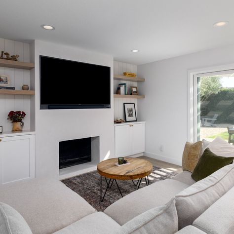 Fireplace Friday: Transform your living space into a cozy retreat with a fireplace remodel. This combination of built-in white shaker cabinetry and custom white oak floating shelves with shiplap accent walls offers both functionality and elegance, providing ample storage and display space for your favorite décor pieces. A stunning white plaster fireplace adds texture and character, while the TV niche ensures seamless integration of modern technology into the timeless design. Embrace warmth ... Oak Shiplap Fireplace, White Plaster Fireplace, White Oak Floating Shelves, Plaster Fireplace, Family Room Rug, Oak Floating Shelves, Shiplap Accent Wall, Fireplace Built Ins, White Shaker Cabinets