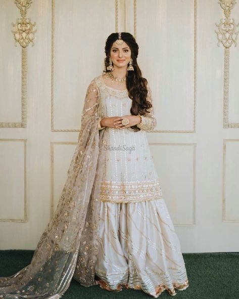 Check out our blog to find 45+ Bridesmaids Outfits/Bride's Sister outfits. we have got beautiul outfits from Suits to Sarees #shaadisaga #indianwedding #bridessisteroutfits #bridessisteroutfitsindian #bridessisteroutfitsideas #lehengaforbridessister #bridessisteroutfitforengagement #bridesisteroutfitsaree #bridesmaidoutfits #bridesmaidoutfitindian #haldibridesmaidoutfits #punjabibridesmaidsoutfits #bridemaidsoutfitsideas #sarees #lehengas #sharara #suits Simple Nikah Outfit, Shadhi Dress, Nikah Dresses, Nikkah Outfit, Desi Attire, Nikah Outfit, Nikah Dress, Nikkah Dress, Asian Bridal Dresses