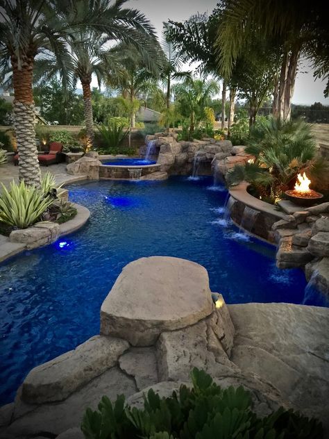 Landscaping Rocks Around Pool, Rustic Pool Landscaping, Rock Feature Pool, Pool With Rocks Around It, Fire Pit And Pool Backyard, Rock Pool Ideas, Organic Pool Design, Custom Pool Designs, Rock Pools Backyard